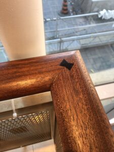 Wood joint with dark bowtie inlay