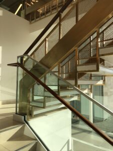 Modern staircase with wood handrail