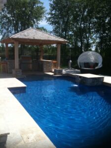 Poolside cabana with outdoor kitchen
